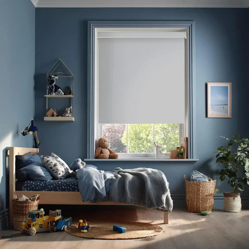 Child's nursery with a cot and two windows