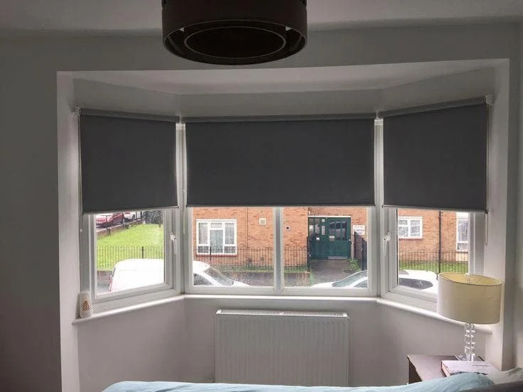 Empty room with a three-panel bay window
