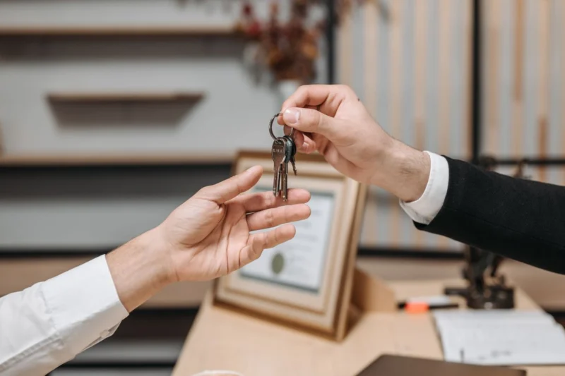 Blinds for a rental property: keys being handed over for a new let