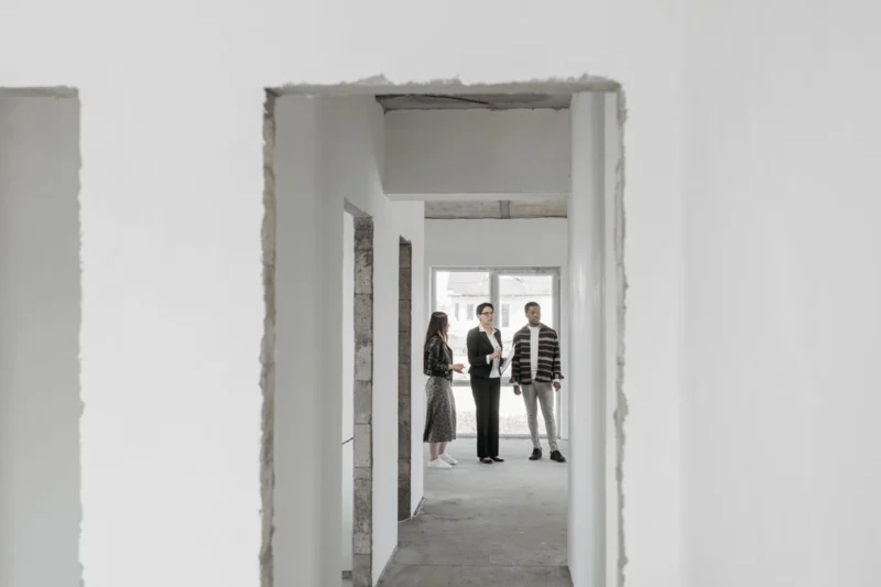 Blinds for new-build homes: an agent showing buyers round an empty new-build