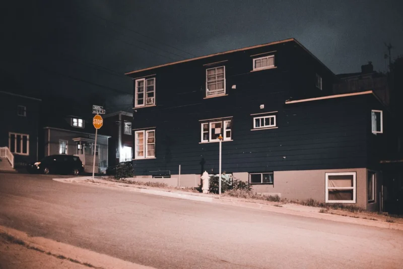 Can people see through blinds at night? Houses on a quiet street after dark