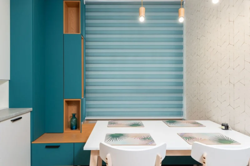Roller blind won't roll up? A day and night roller blind lowered over a kitchen window